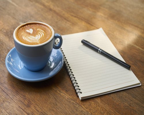Man taking a short walking break in park with coffee